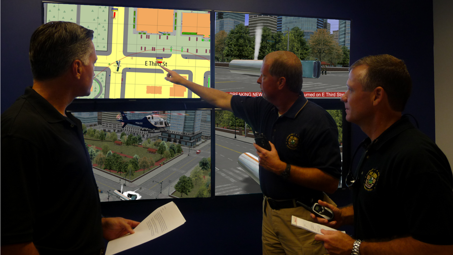 Command Post Staff organizing their multi-agency response to a large scale incident taking place in virtual reality. 