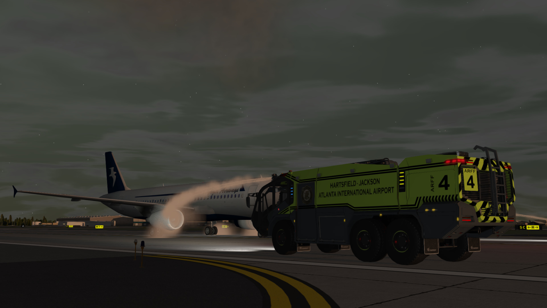 Rosenbauer Panther ARFF Truck extinguishing an aircraft engine fire during sundown at Atlanta Airport.