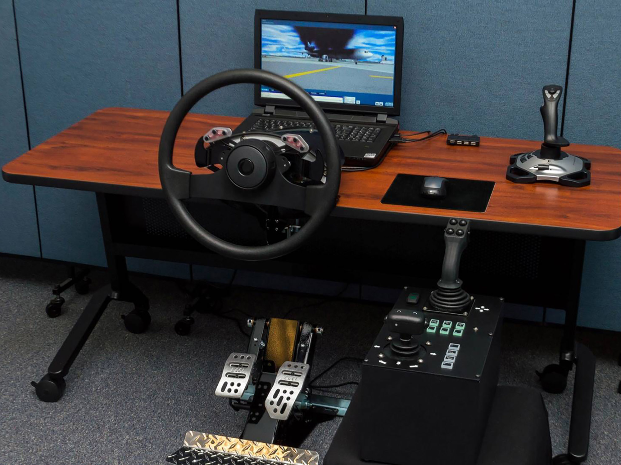 Desktop ARFF and Airport Drive Trainer consists of a generic steering wheel and controls packed in transportation cases.