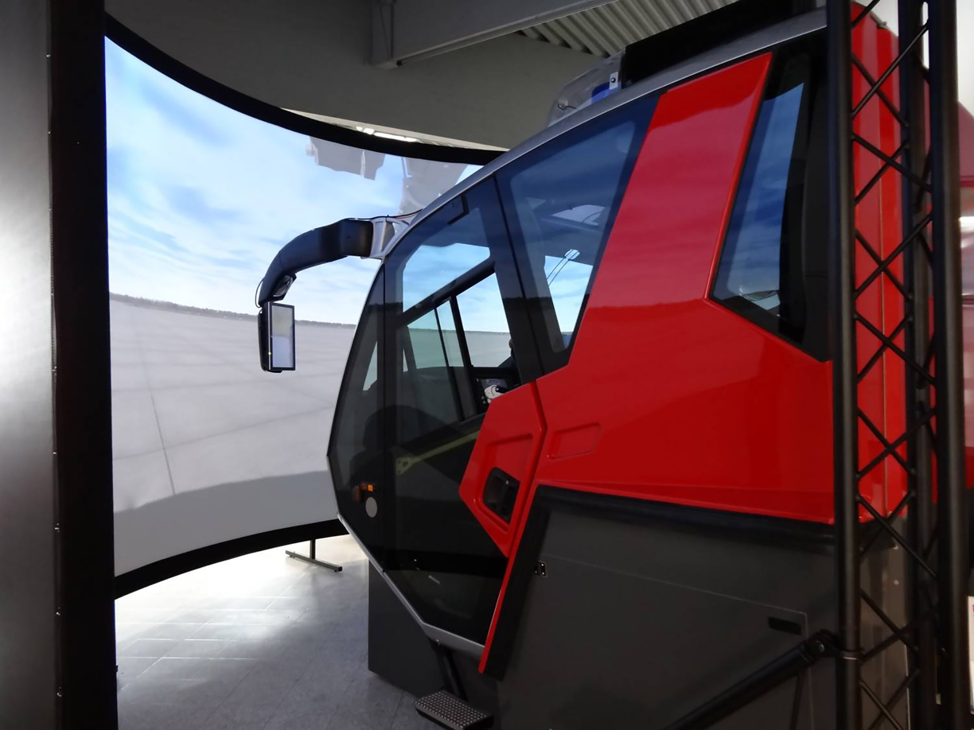 Full-sized Rosenbauer Panther Cabin with a 210-degree projection screen for full immersion to train ARFF Operations.  