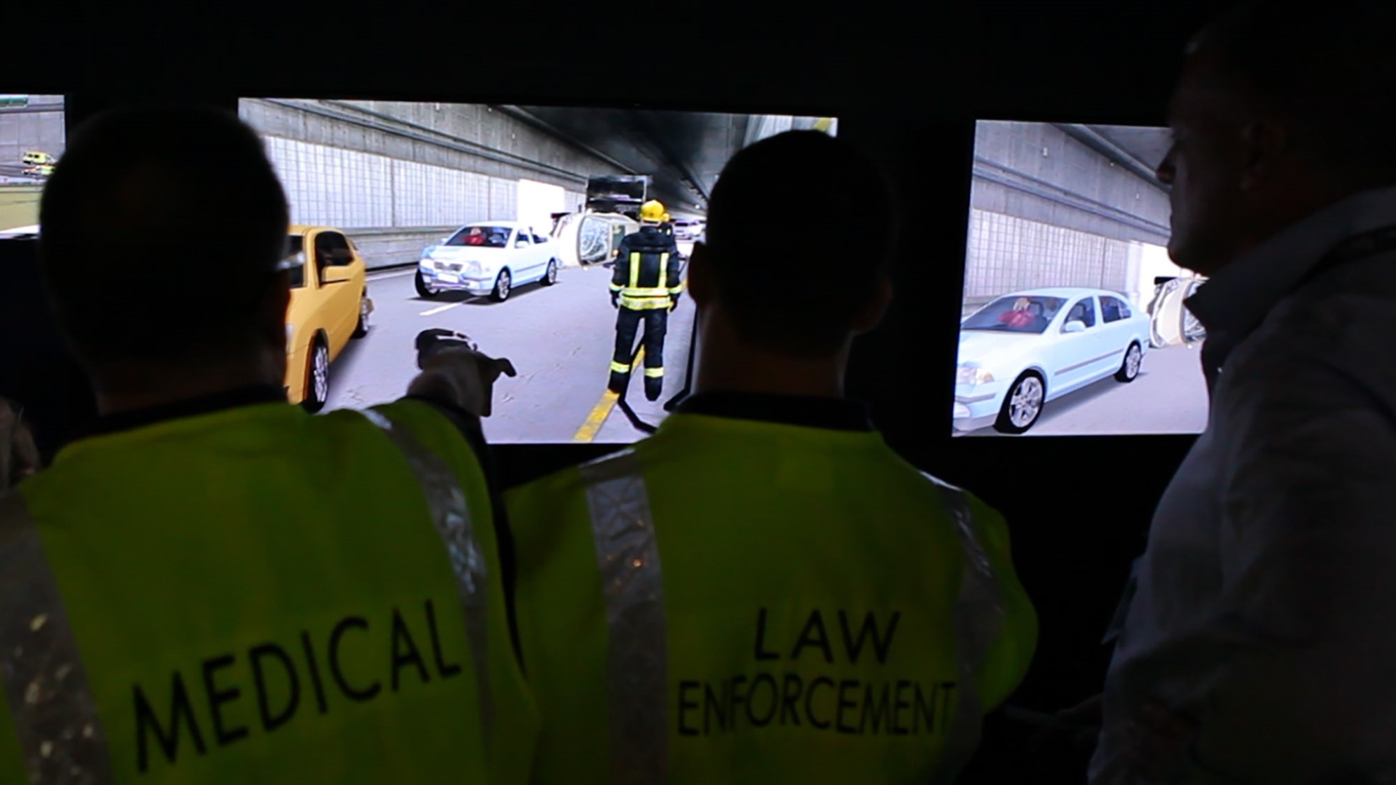 Medical and Law Enforcement trainees cooperating on a simulated traffic accident inside the tunnel.