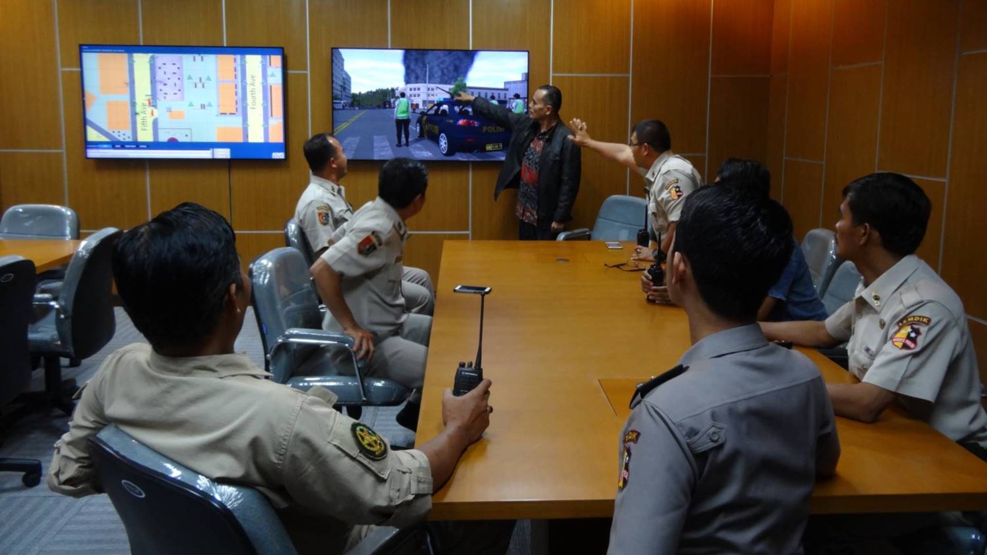 News coverage of aircraft crash in the forest surrounded by fire during a command training exercise using ADMS. 