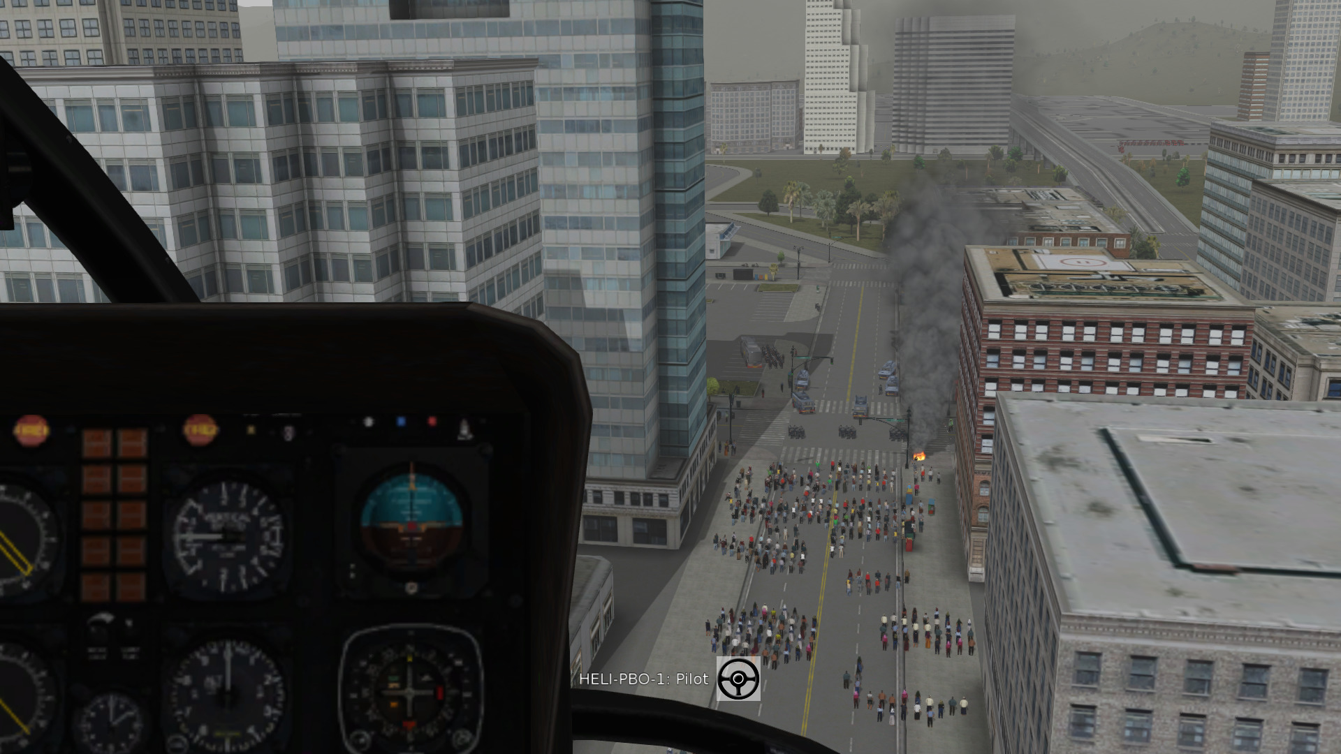 Live helicopter view of a riot moving towards the city center, providing information to the command post in simulation.